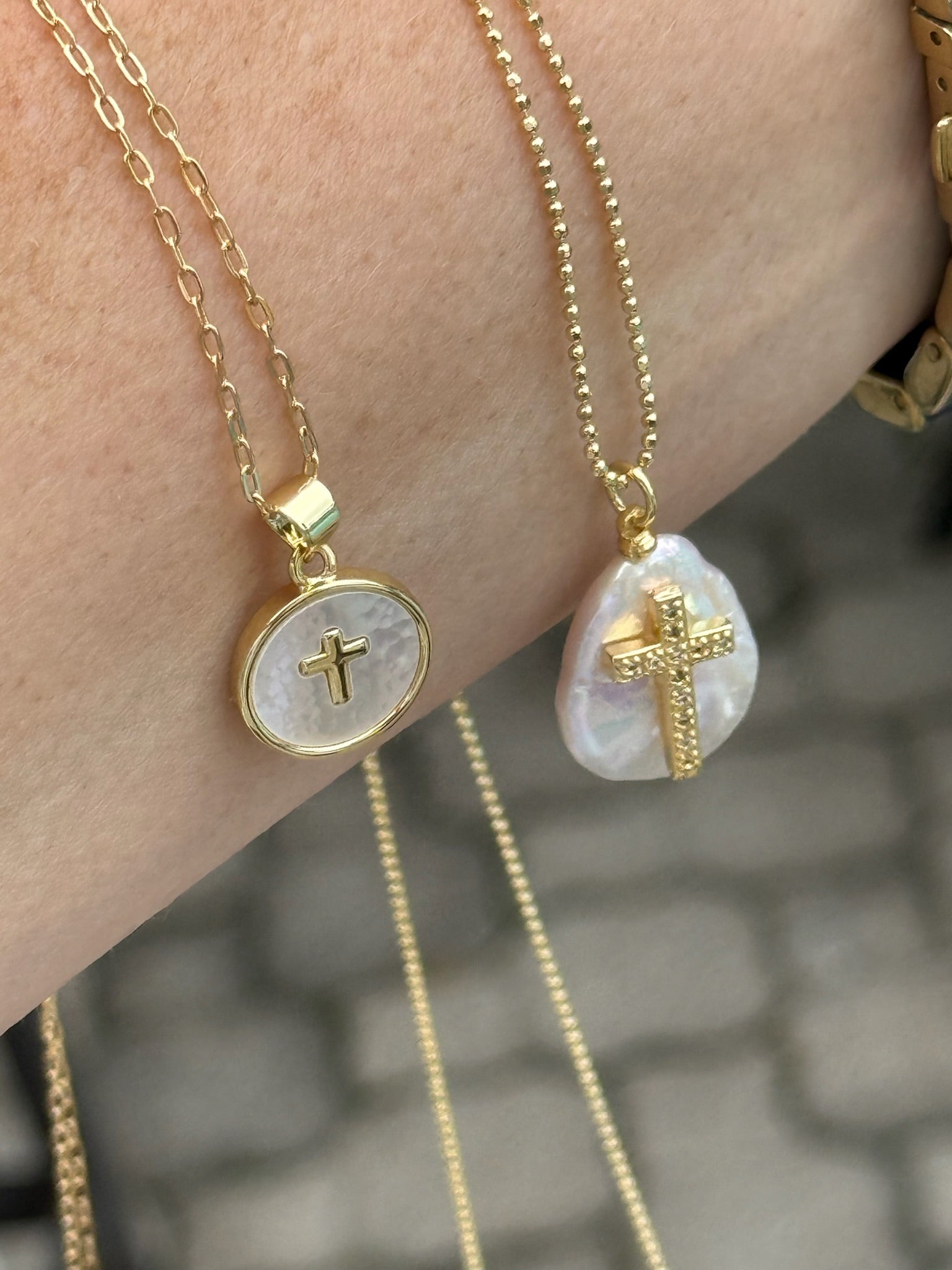 Gold cross pendant necklaces with mother of pearl accents on delicate chains from Ardor Boutique