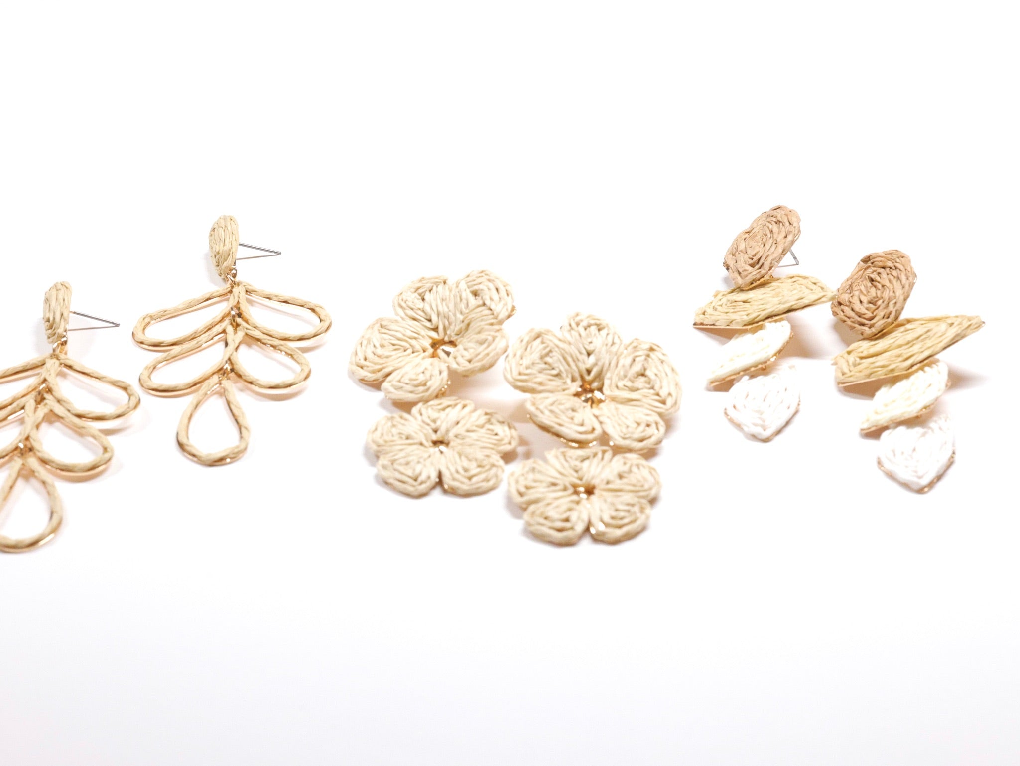 Assorted woven raffia statement earrings in neutral cream and beige floral and drop designs from Ardor Boutique