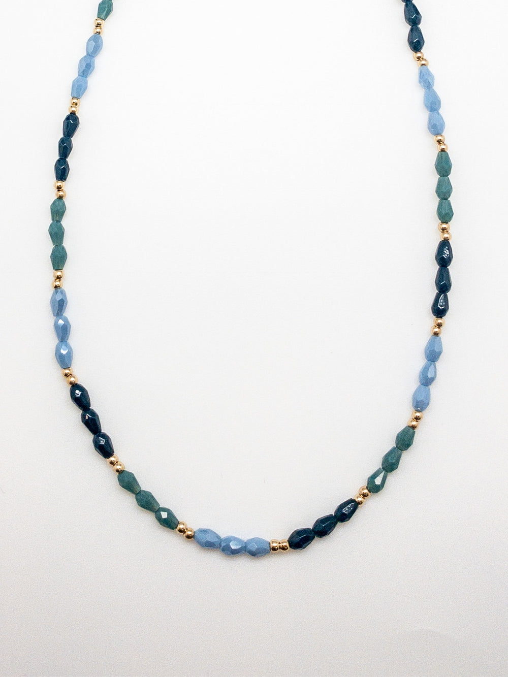 Skylar Beaded Necklace. Blue beads with gold accents.