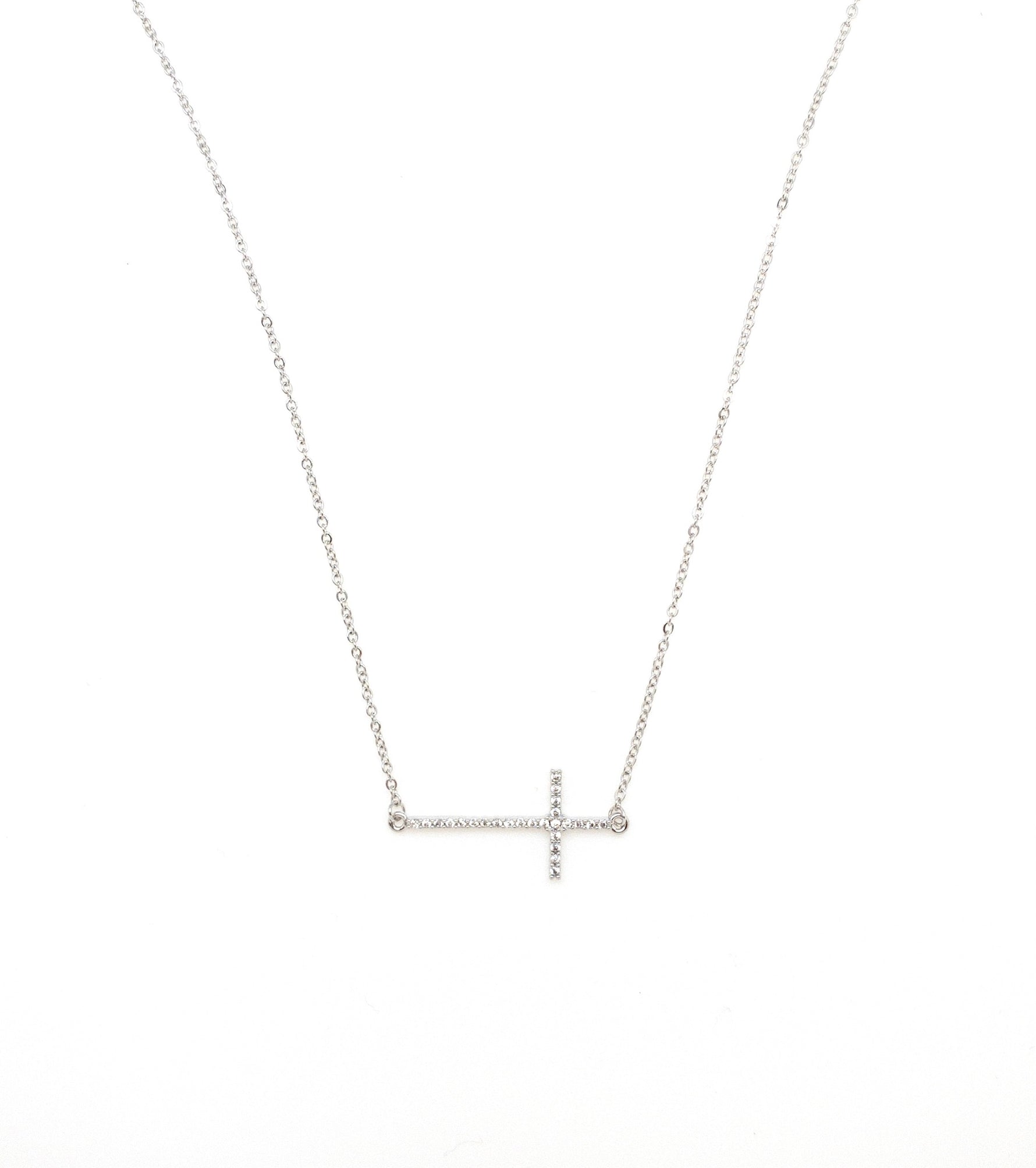 Silver sideways cross necklace.