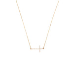 Gold sideways cross necklace.