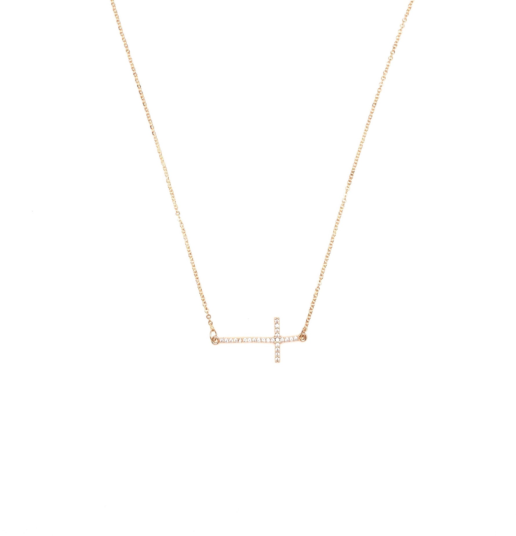 Gold sideways cross necklace.