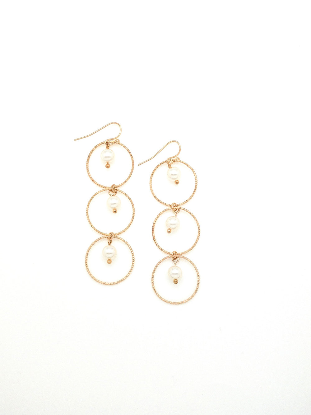 Christina earrings. 3 gold circles with pearl in center of each