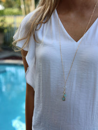 Aqua druzy necklace styled long on model