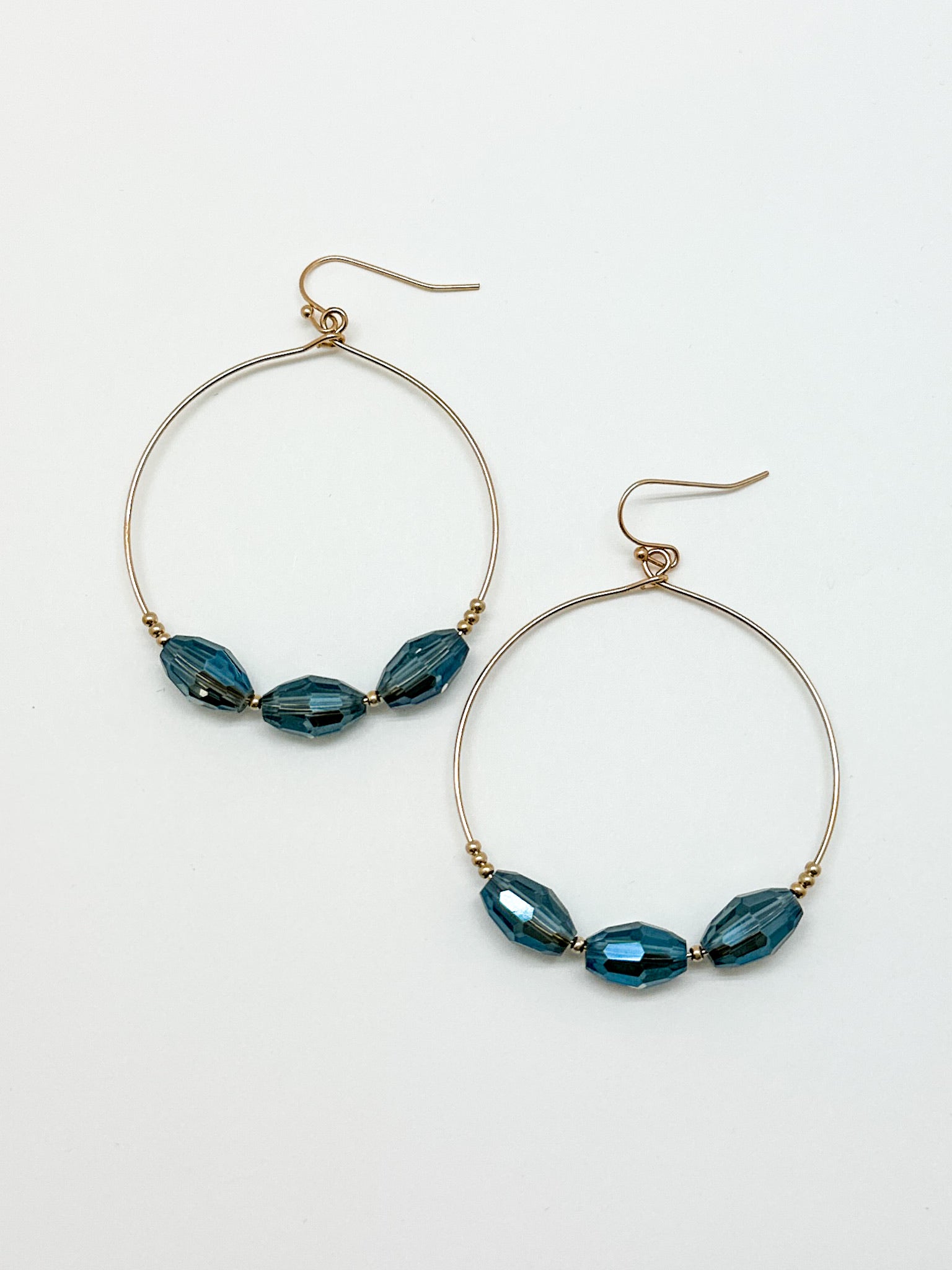 3 Blue Beaded Hoop Earrings. Gold hoop earrings with blue beads.