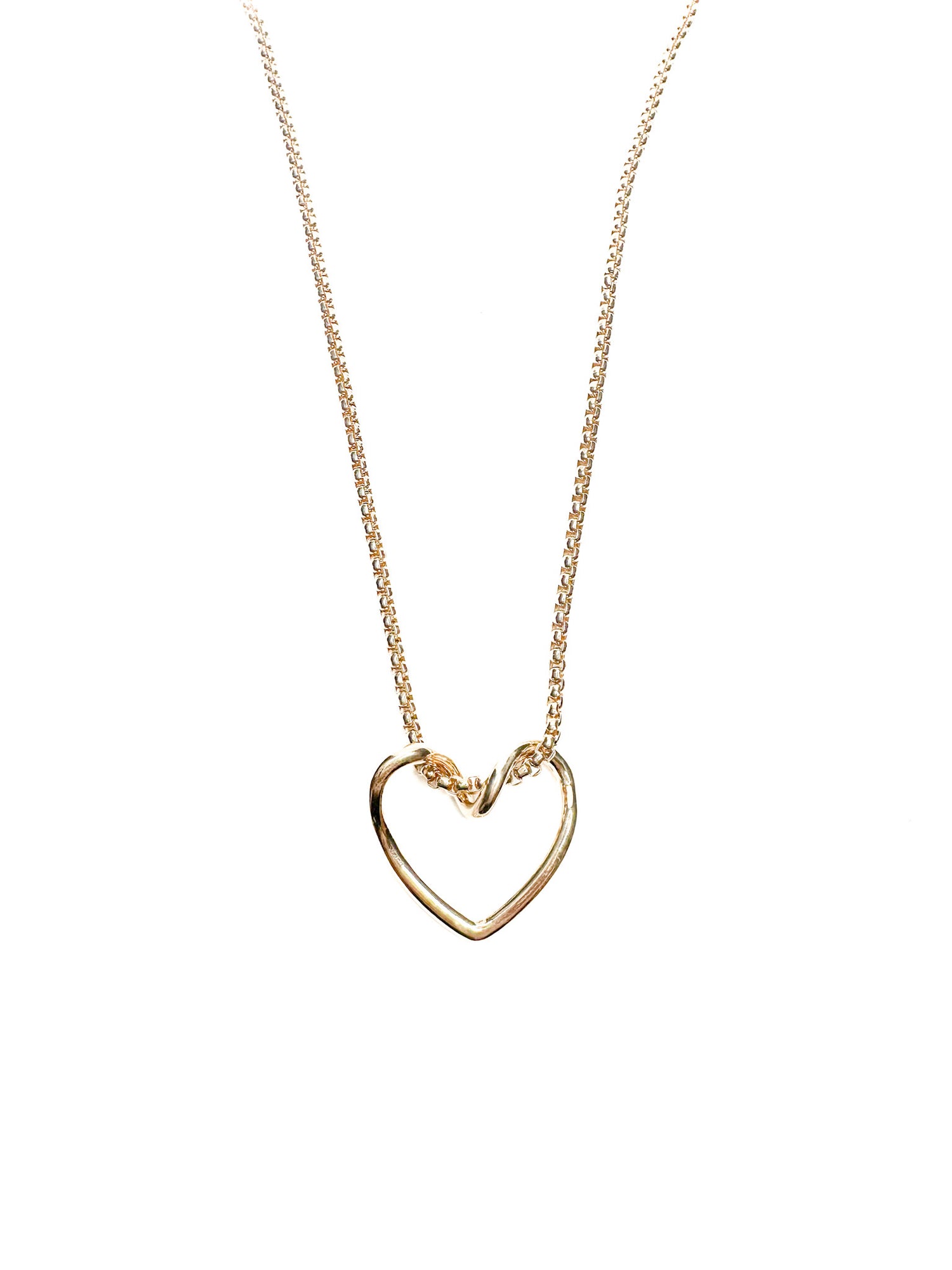 Gold heart-shaped necklace on a white background