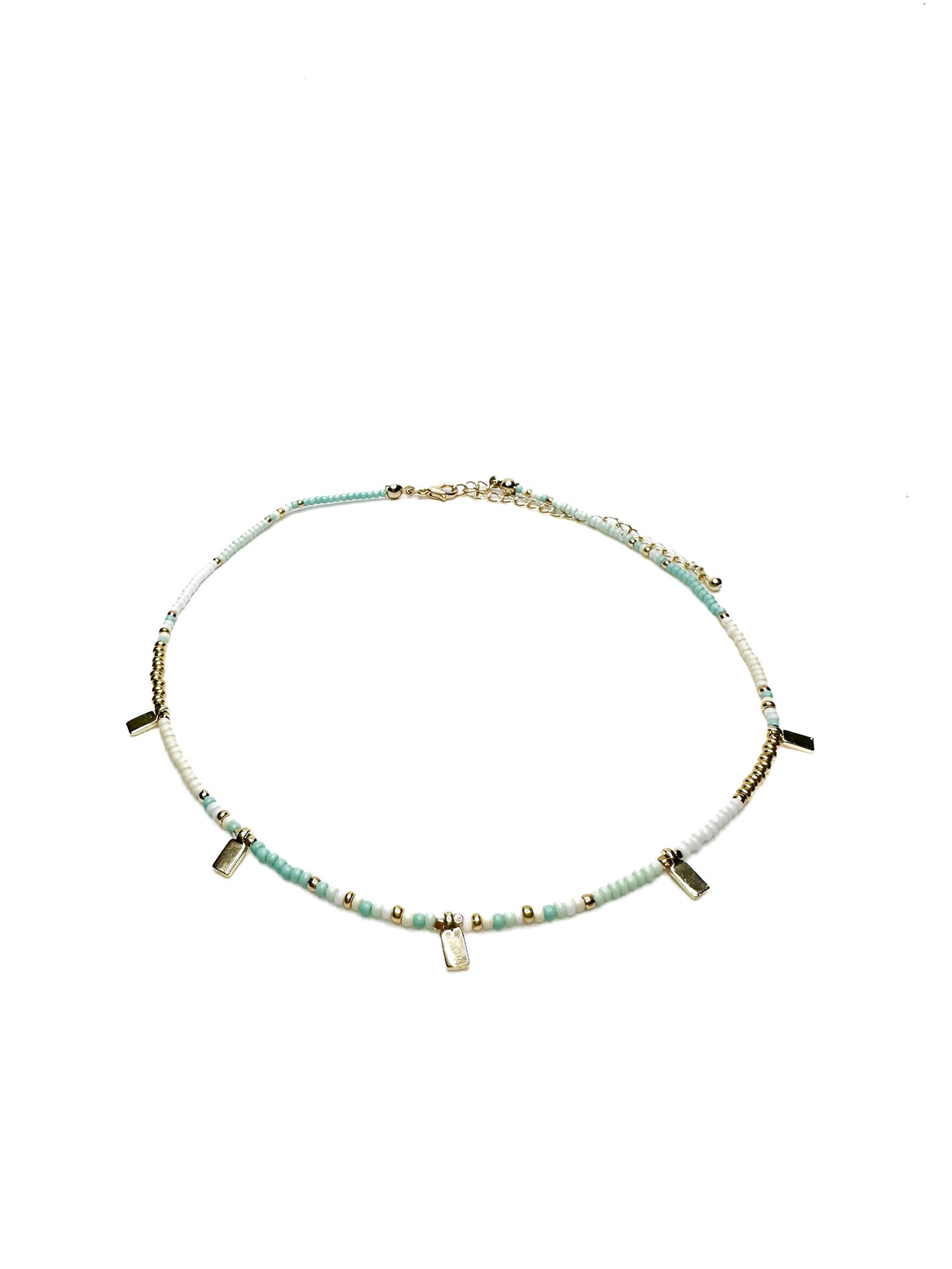 Necklace with small beads and petite gold accents on a white background