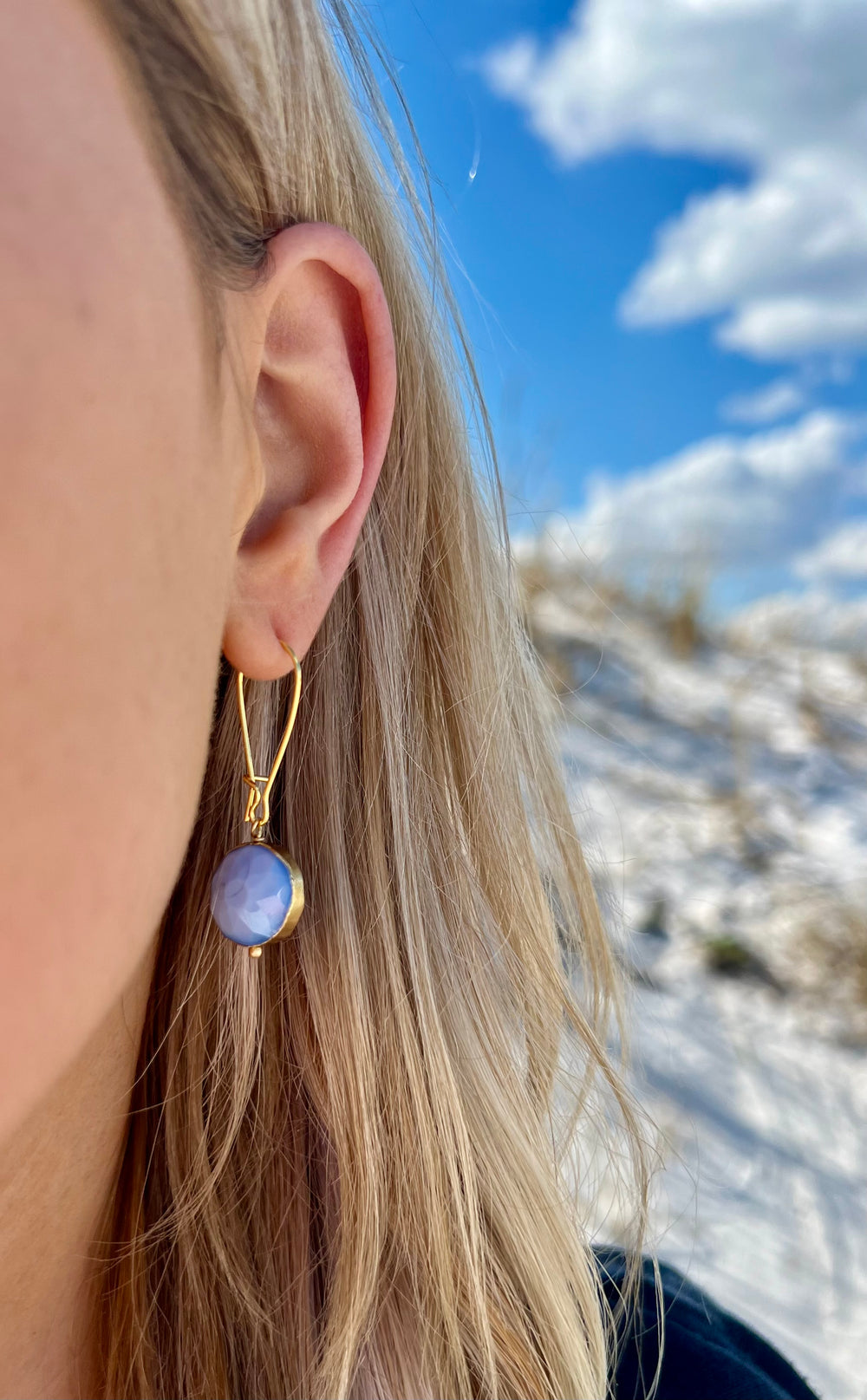 Blue and gold handmade nickel free earrings circular shaped in ear 