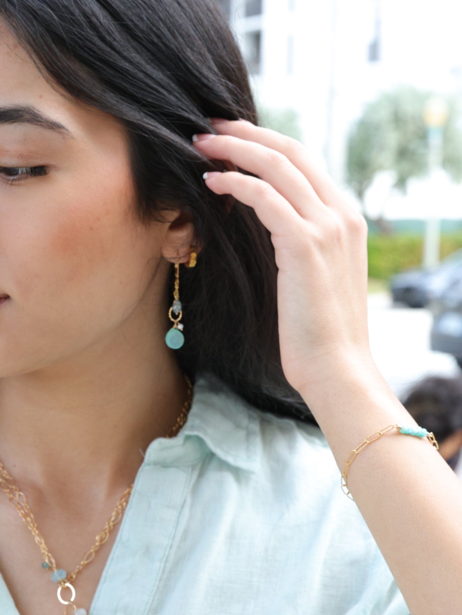 model wearing the amazonite cube bracelet paired with earrings and a necklace