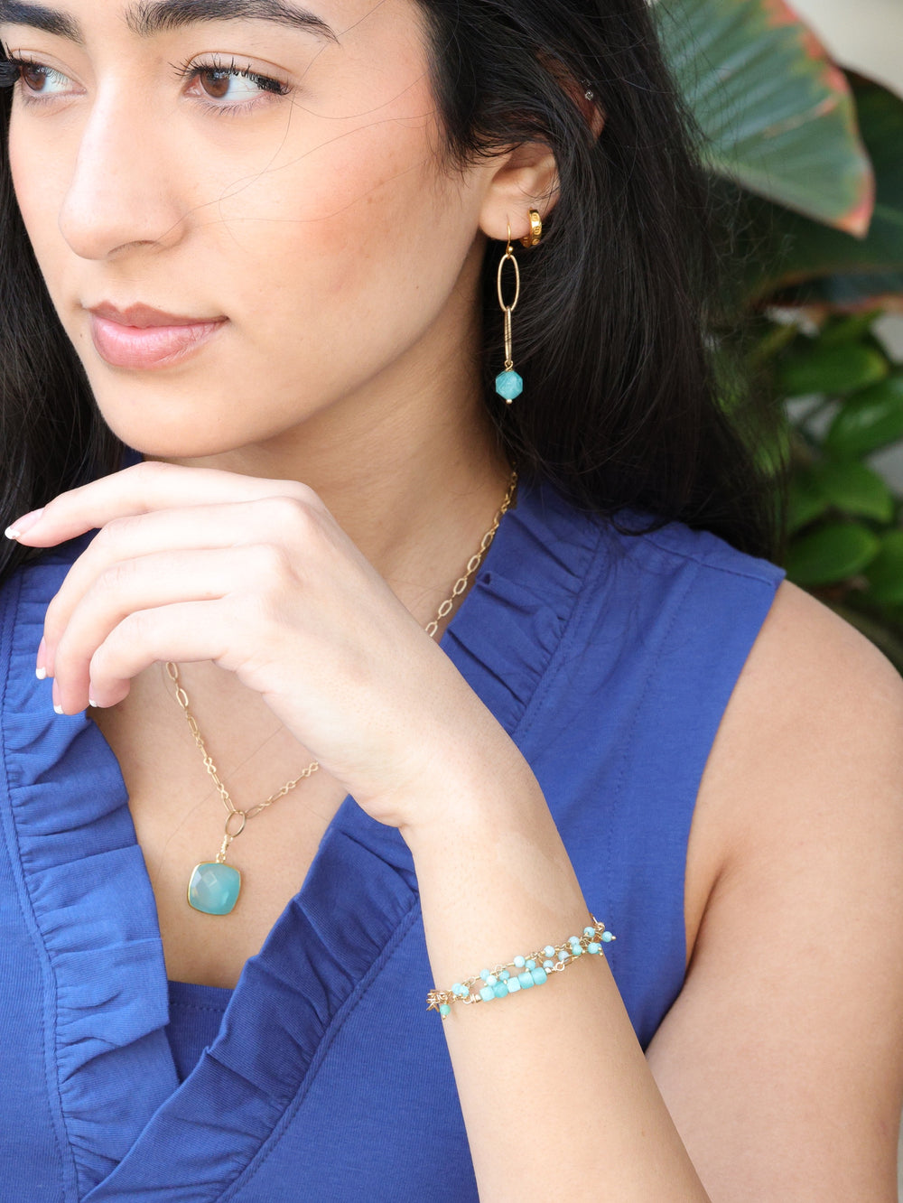 Aqua chalcedony necklace on model paired with pieces from the nh Aqua gold collection 