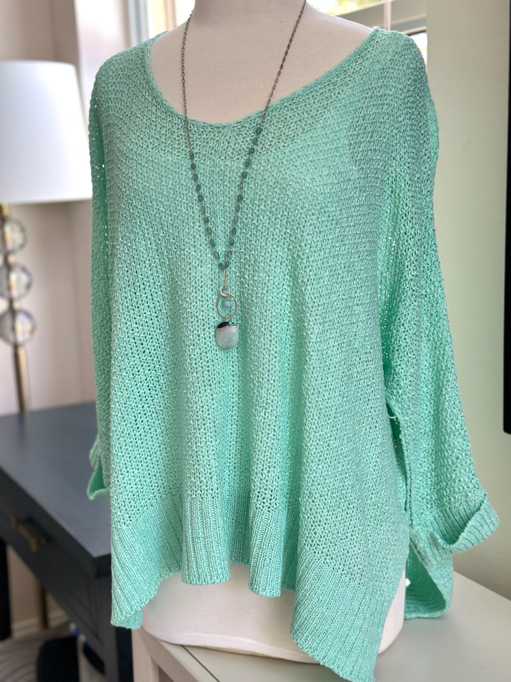 Front of Anya knitted top in mint styled on a mannequin 