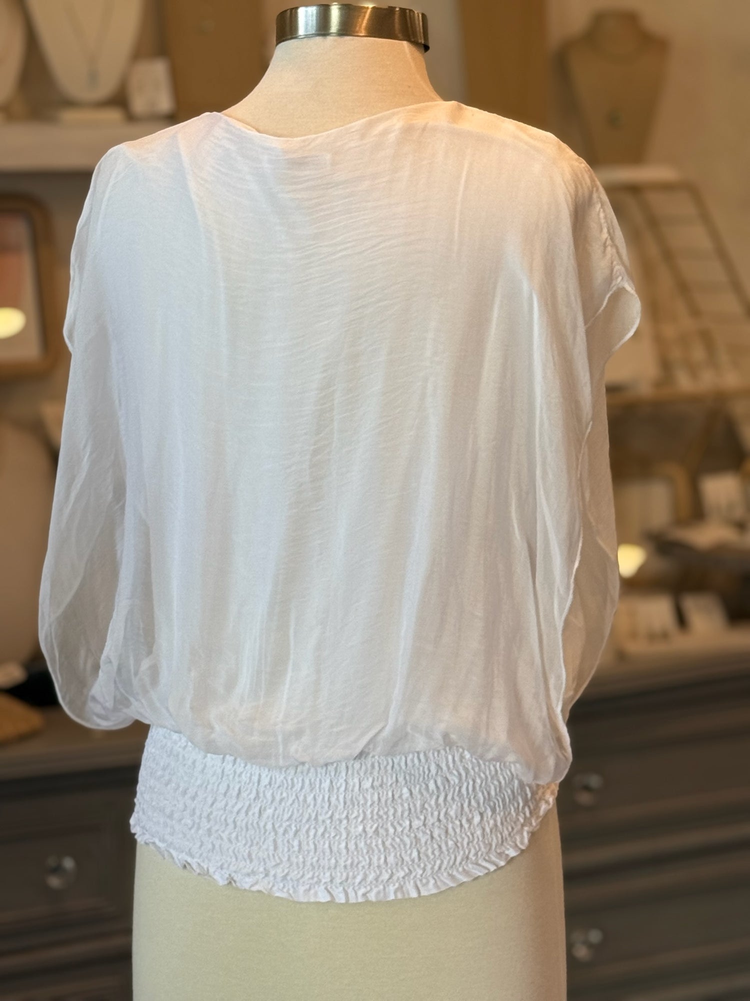 back of white blouse