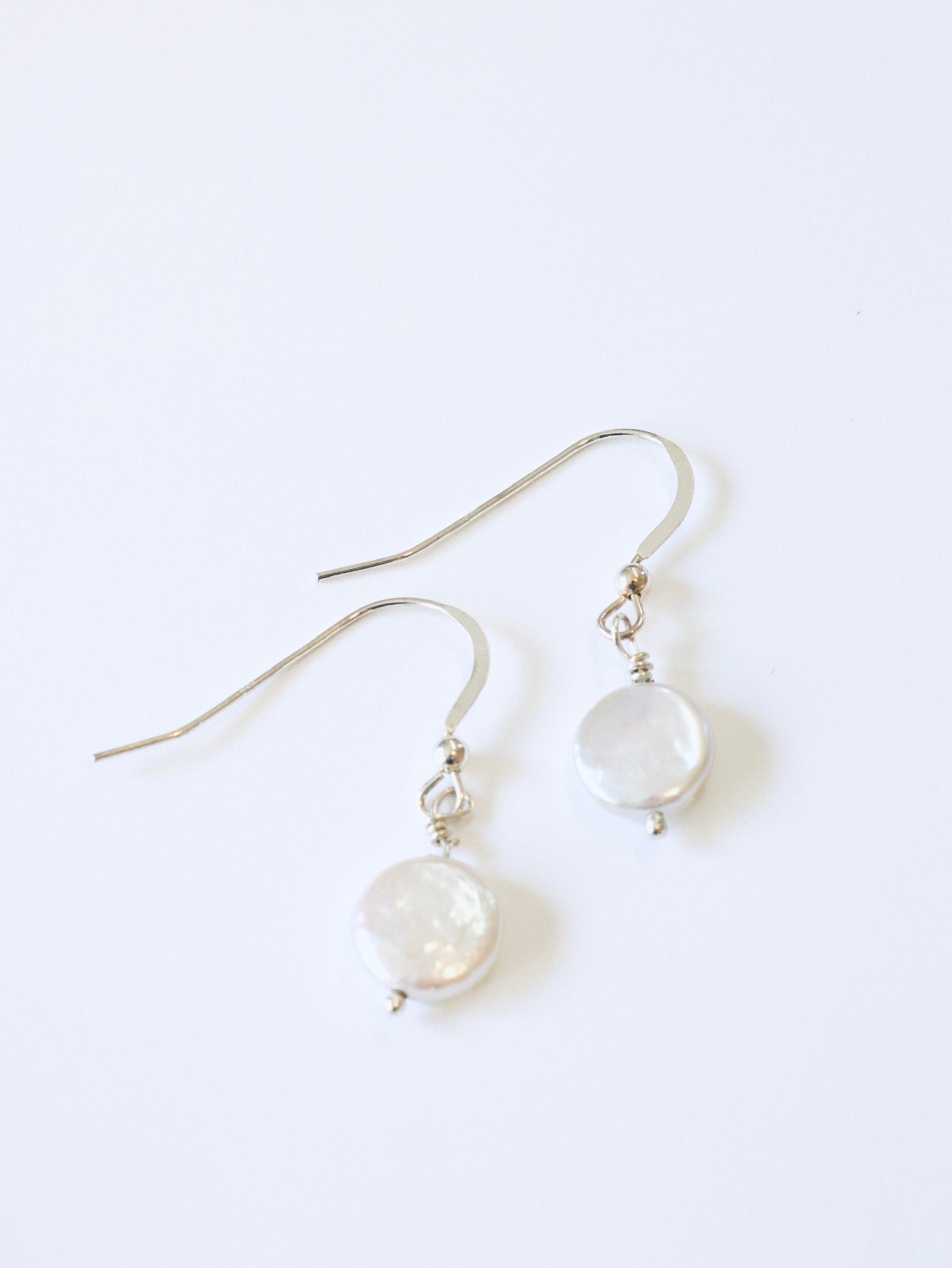 Simple coin pearl earrings in creamy white