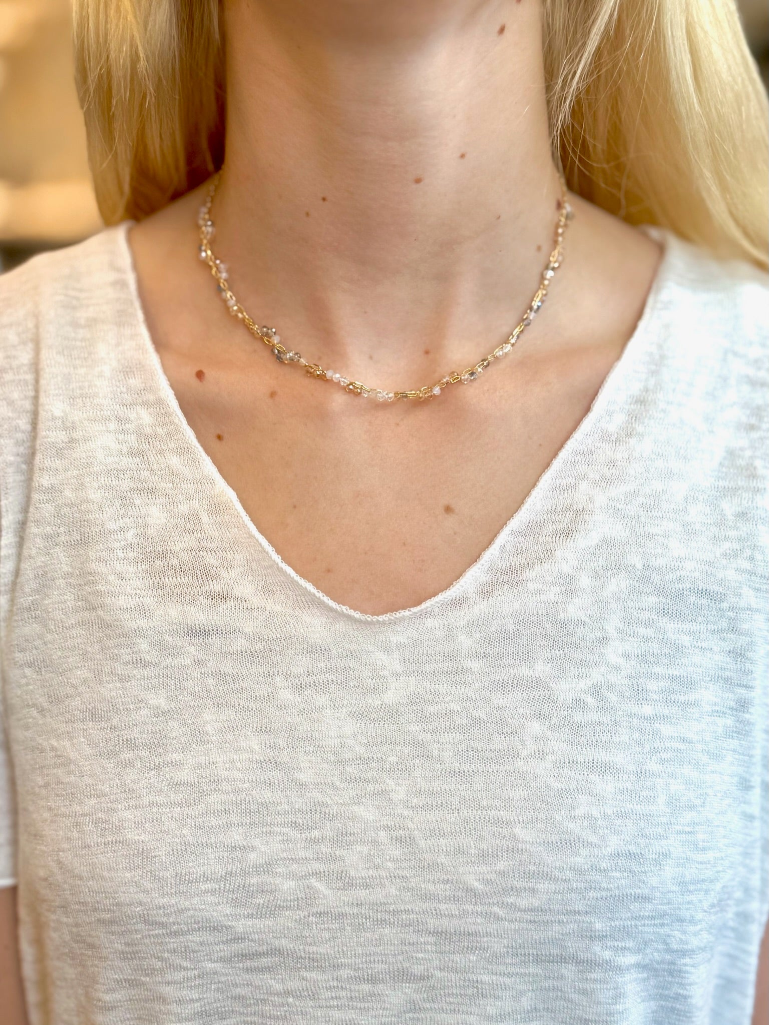 Necklace worn by a person with a neutral background