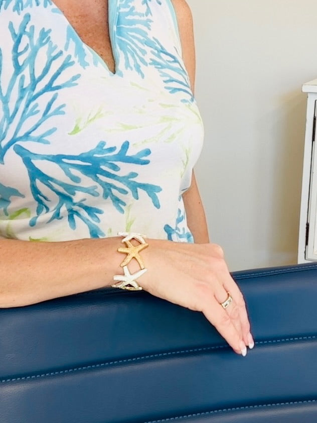 2 toned silver and gold starfish stretch bracelet on model