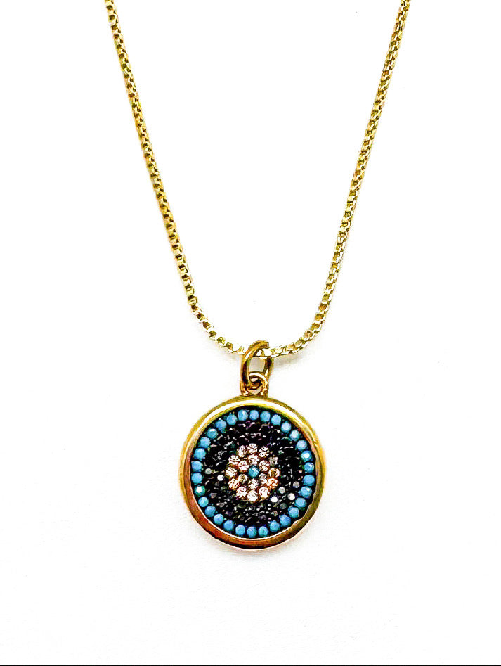 Necklace with a circular pendant featuring colorful stones on a white background