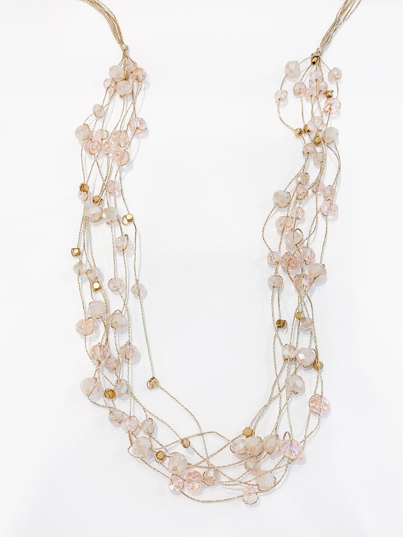 Stella beaded necklace in blush. Multiple strands of scattered beads