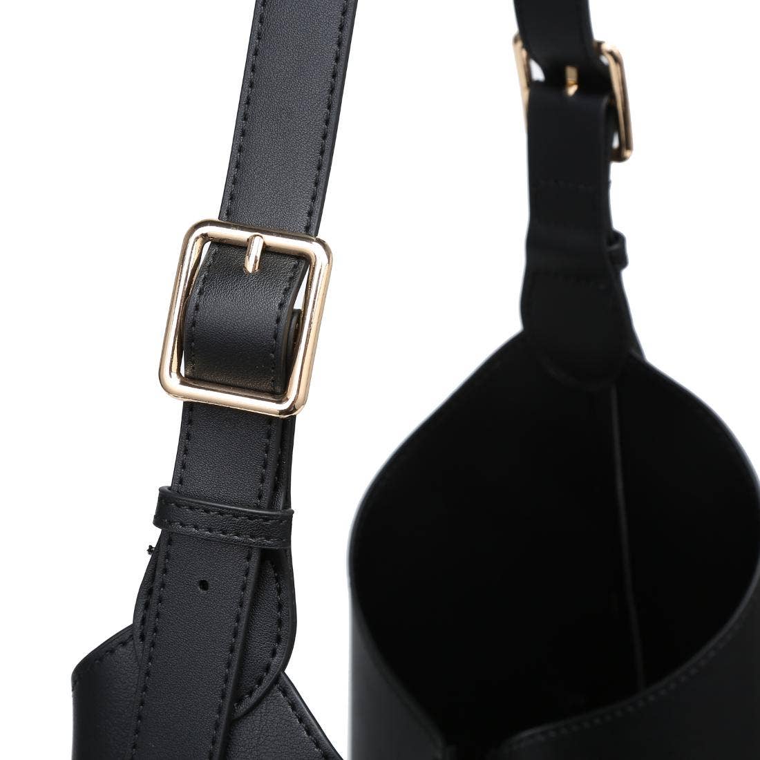 Black leather bag with gold buckle on a white background