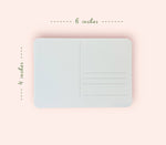 Light blue postcard with dimensions labeled on a pink background