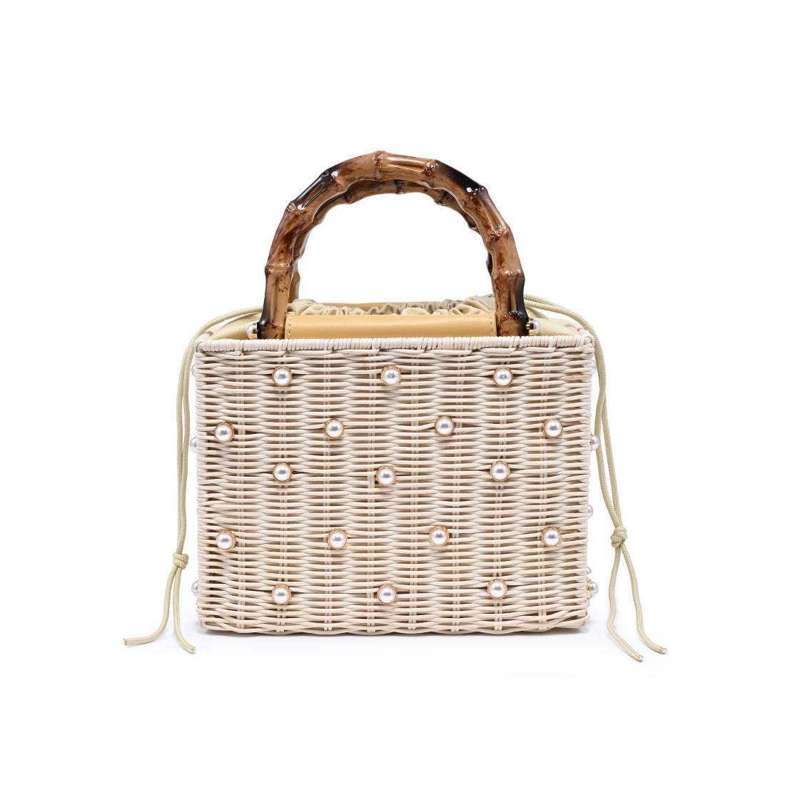 Wicker handbag with bamboo handle and pearl embellishments on a white background