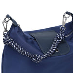 A navy blue nylon shoulder bag featuring a dark navy leather flap pocket and a thick, knotted navy-and-white braided rope shoulder strap with silver-tone hardware.
