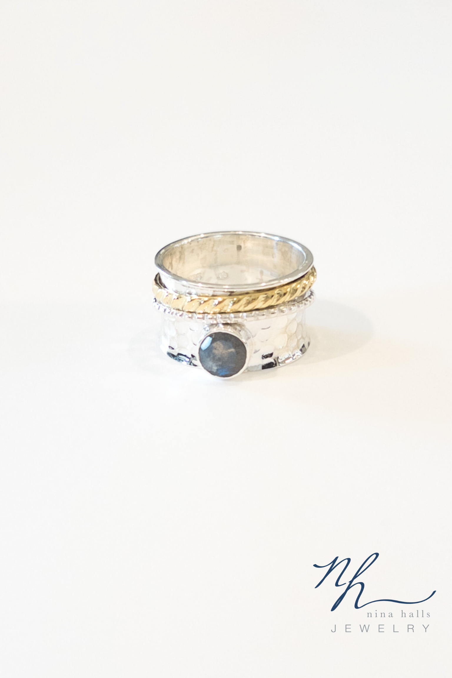 Cordelia spinner ring with logo 