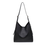 Black handbag on a white background