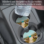 Car cup holder with a sand dune design coaster and text about standard size for various vehicles.