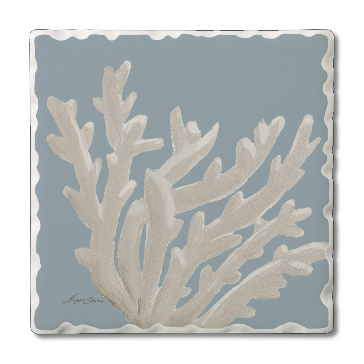 Decorative tile with beige coral design on a blue background
