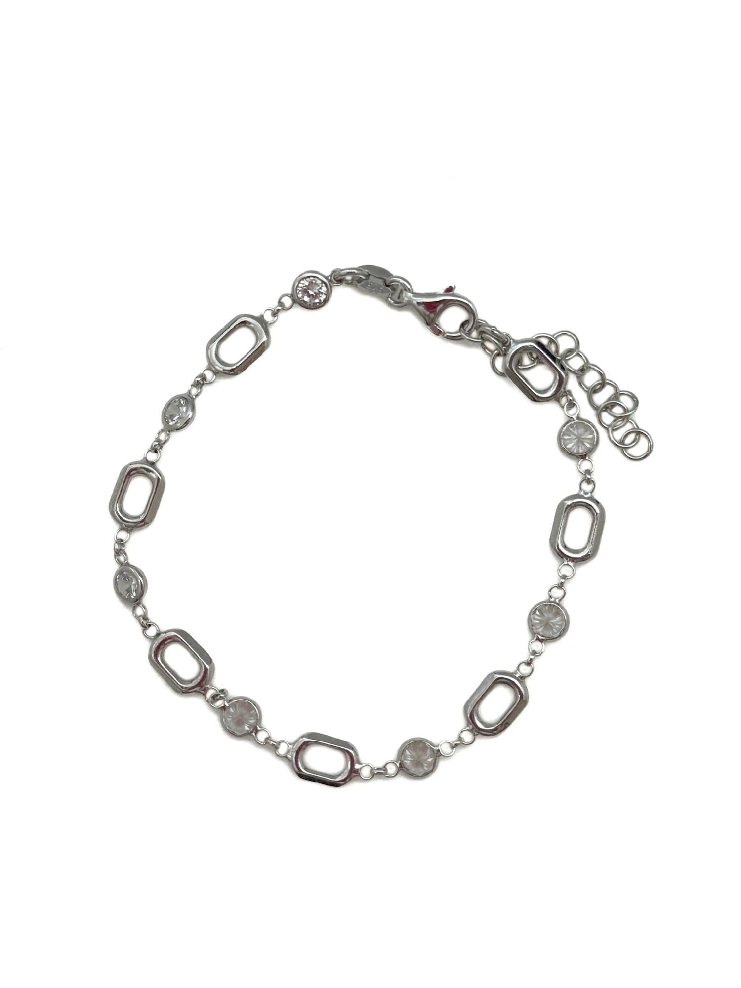 Silver bracelet with oval links on a white background