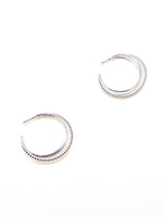 Pair of silver hoop earrings on a white background
