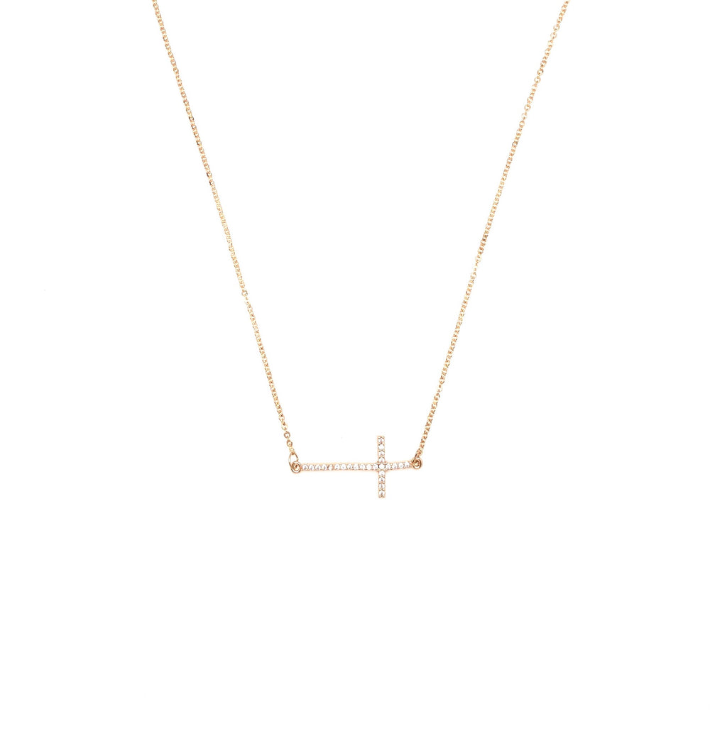 Gold sideways cross necklace. 