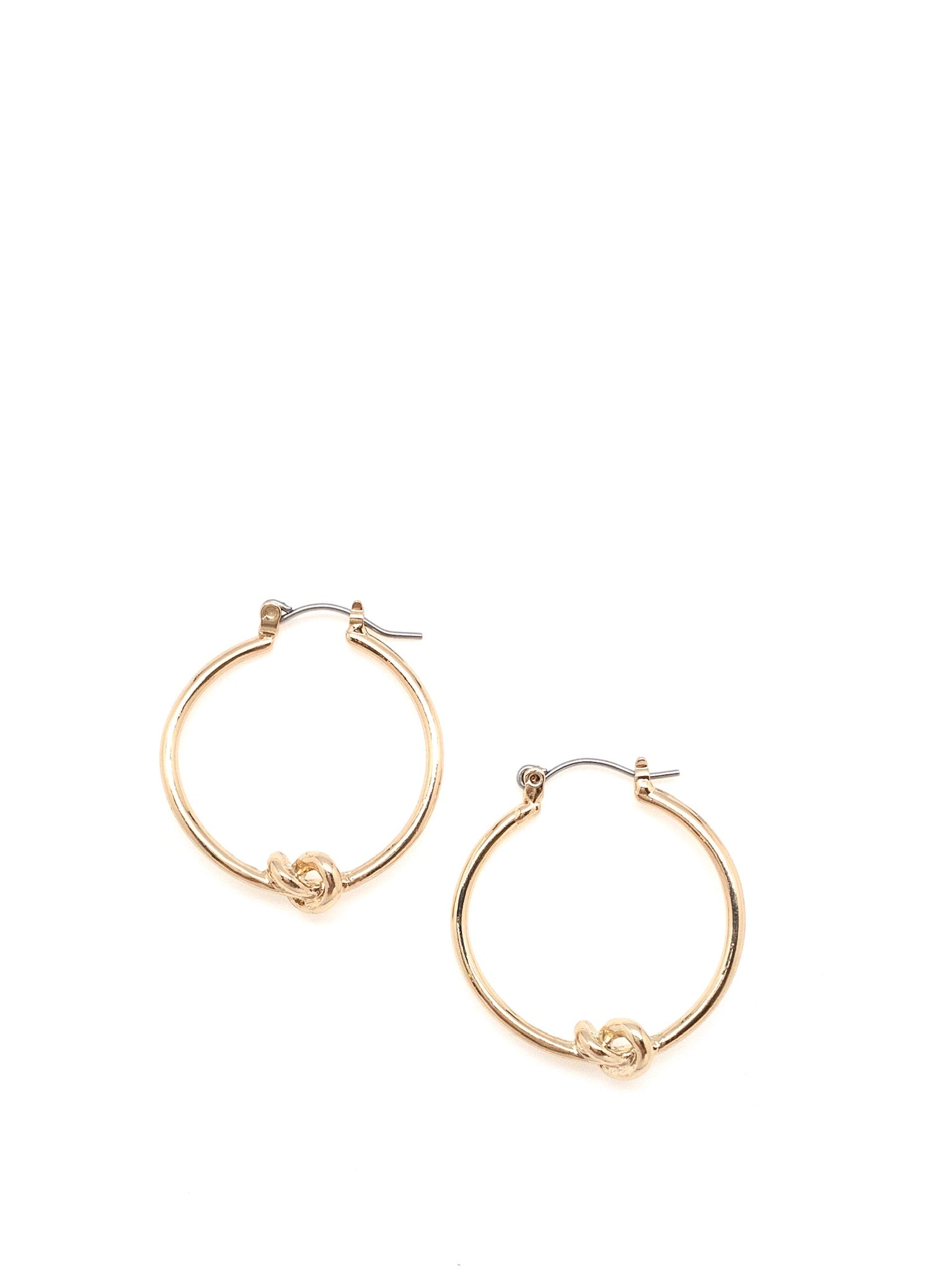 Gold hoop earrings with a knot detail in the bottom center