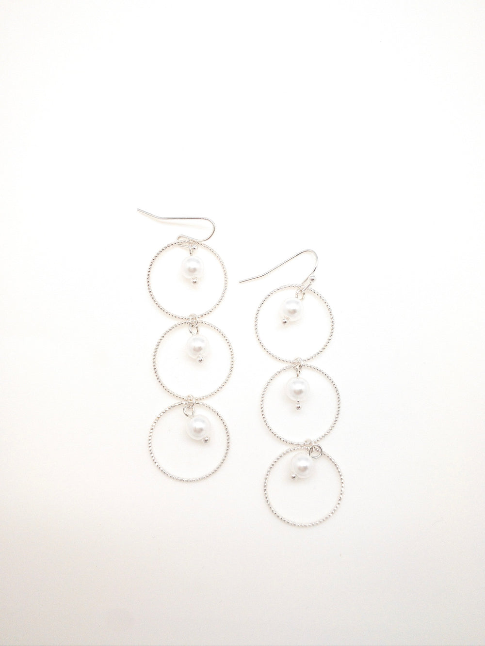 Christina earrings silver. 3 circles with pearls in center of each 