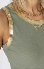 Green ribbed tank top with gold trim on a white background
