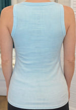 Back view of Alessia Tank in light blue ribbed knit with gold trim detail at neckline and straps.