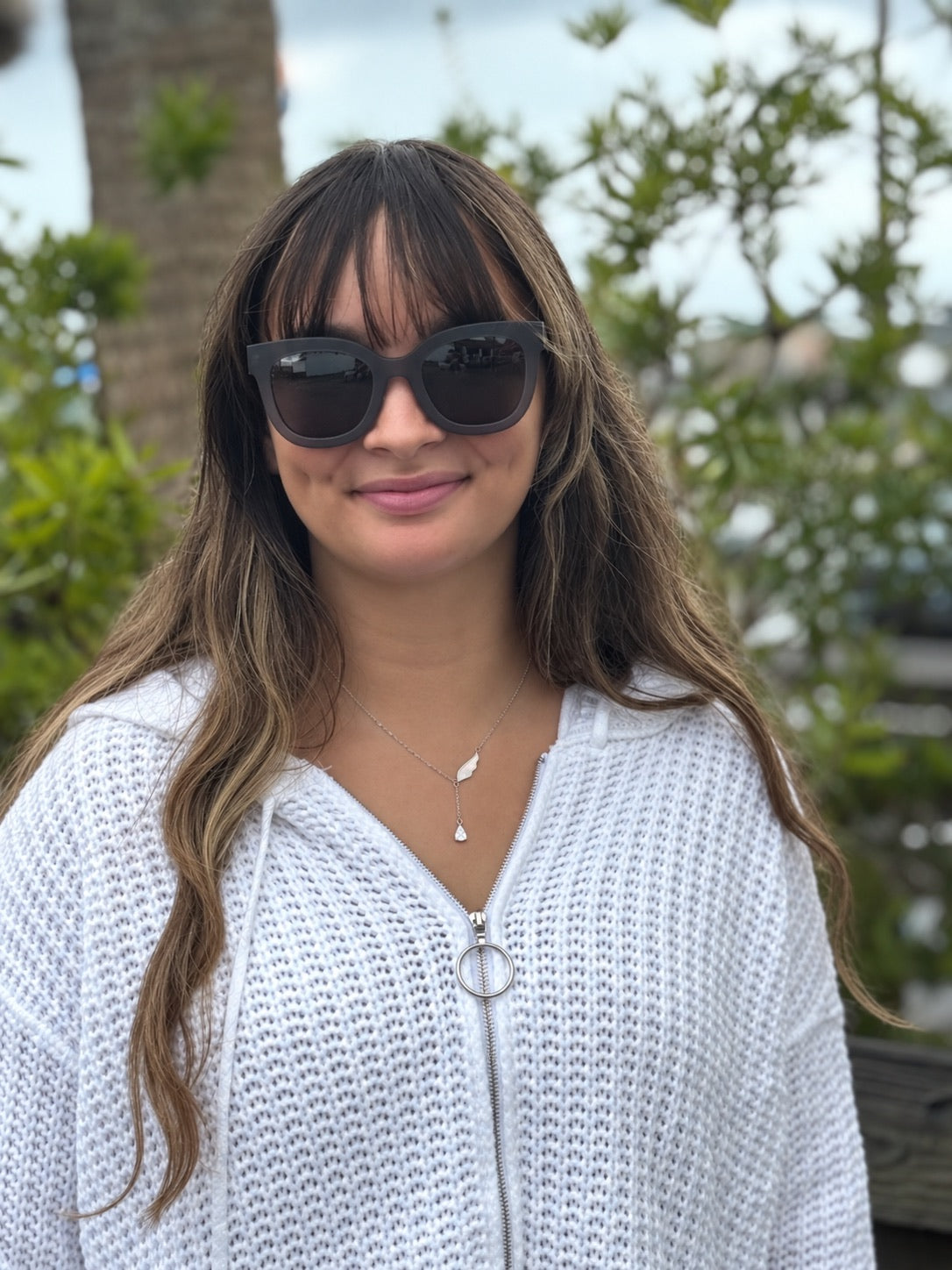 Angelica Silver Necklace styled with white hoodie and sunglasses