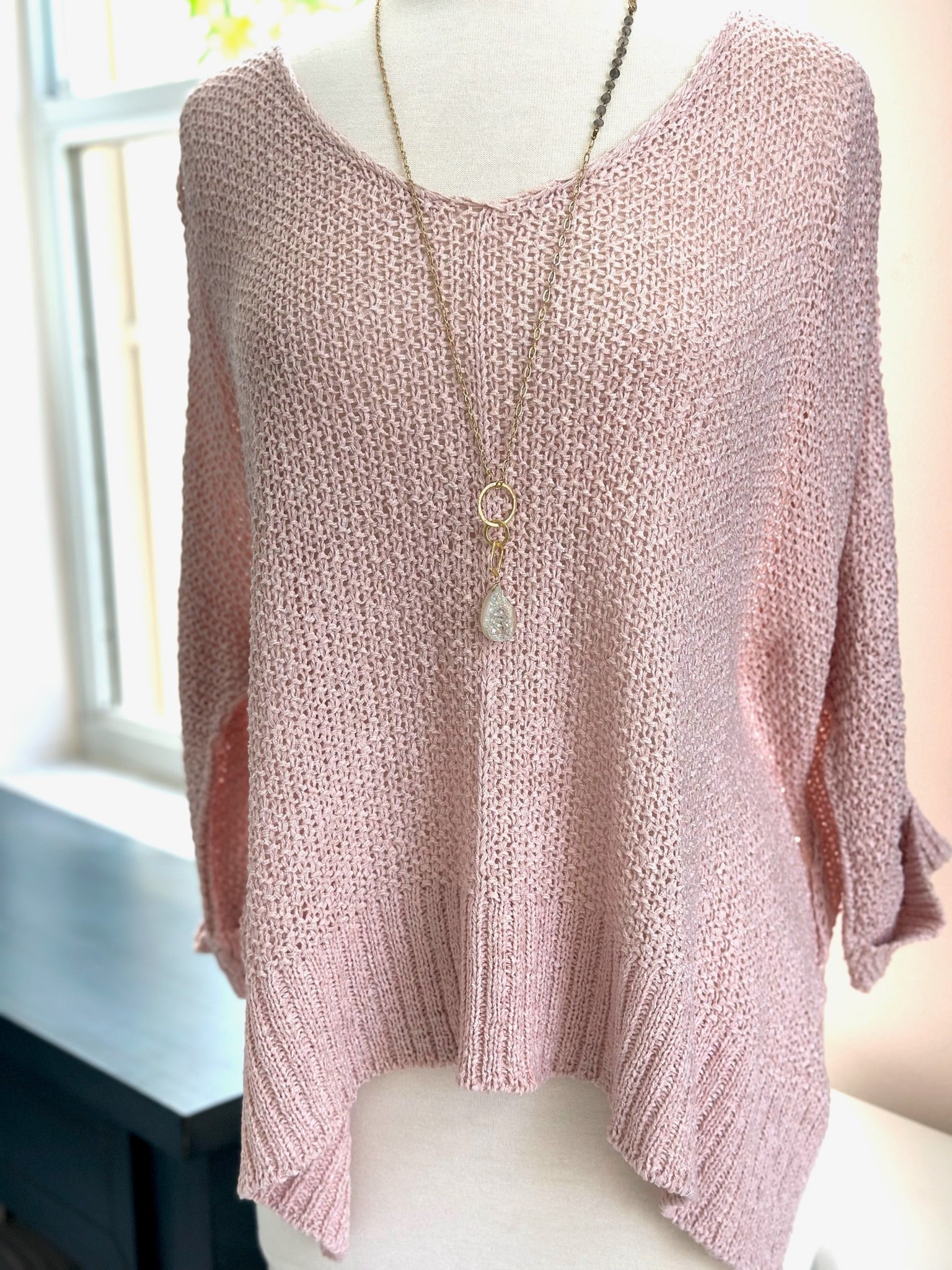 Anya Knitted Sweater in Pink on mannequin styled with long gold necklace