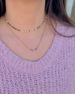 Ava Tourmaline Necklace shown layered with shorter necklace on model. Stainless steal layered necklaces.
