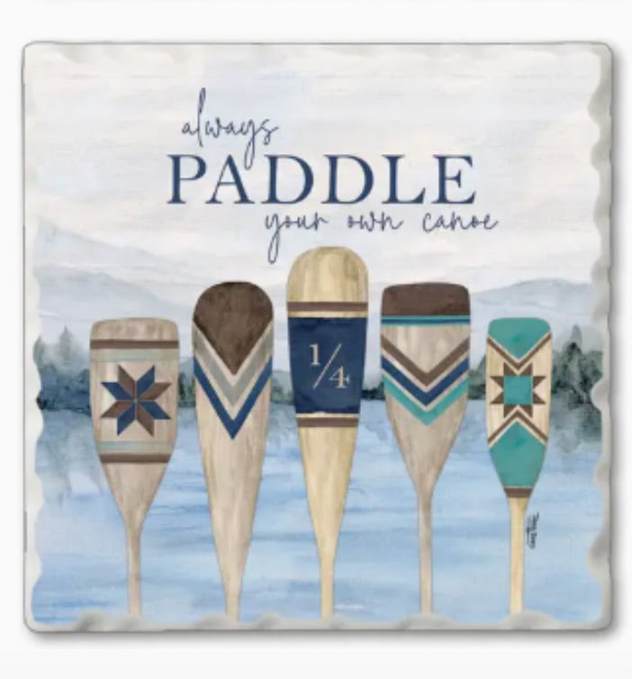 Square decorative tile or coaster featuring a watercolor-style illustration of five wooden paddles on blue water, with the phrase 'always PADDLE your own canoe' above them.