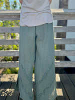 Back view of Tia linen pants in green at Ardor Boutique