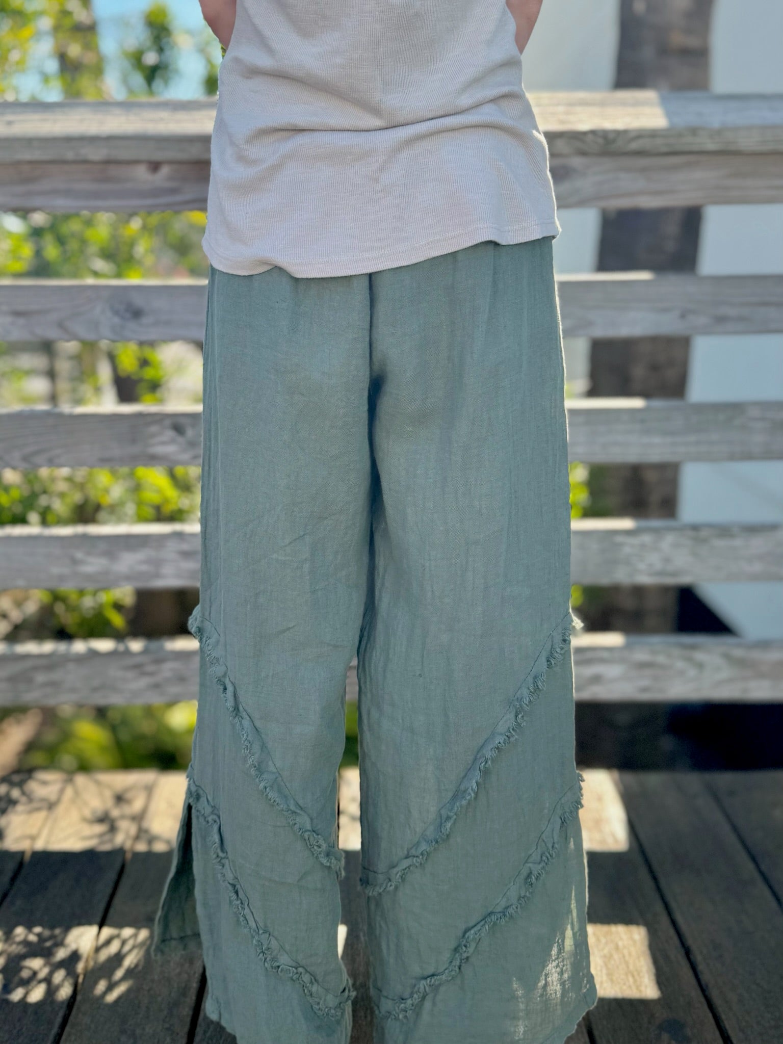 Back view of Tia linen pants in green at Ardor Boutique