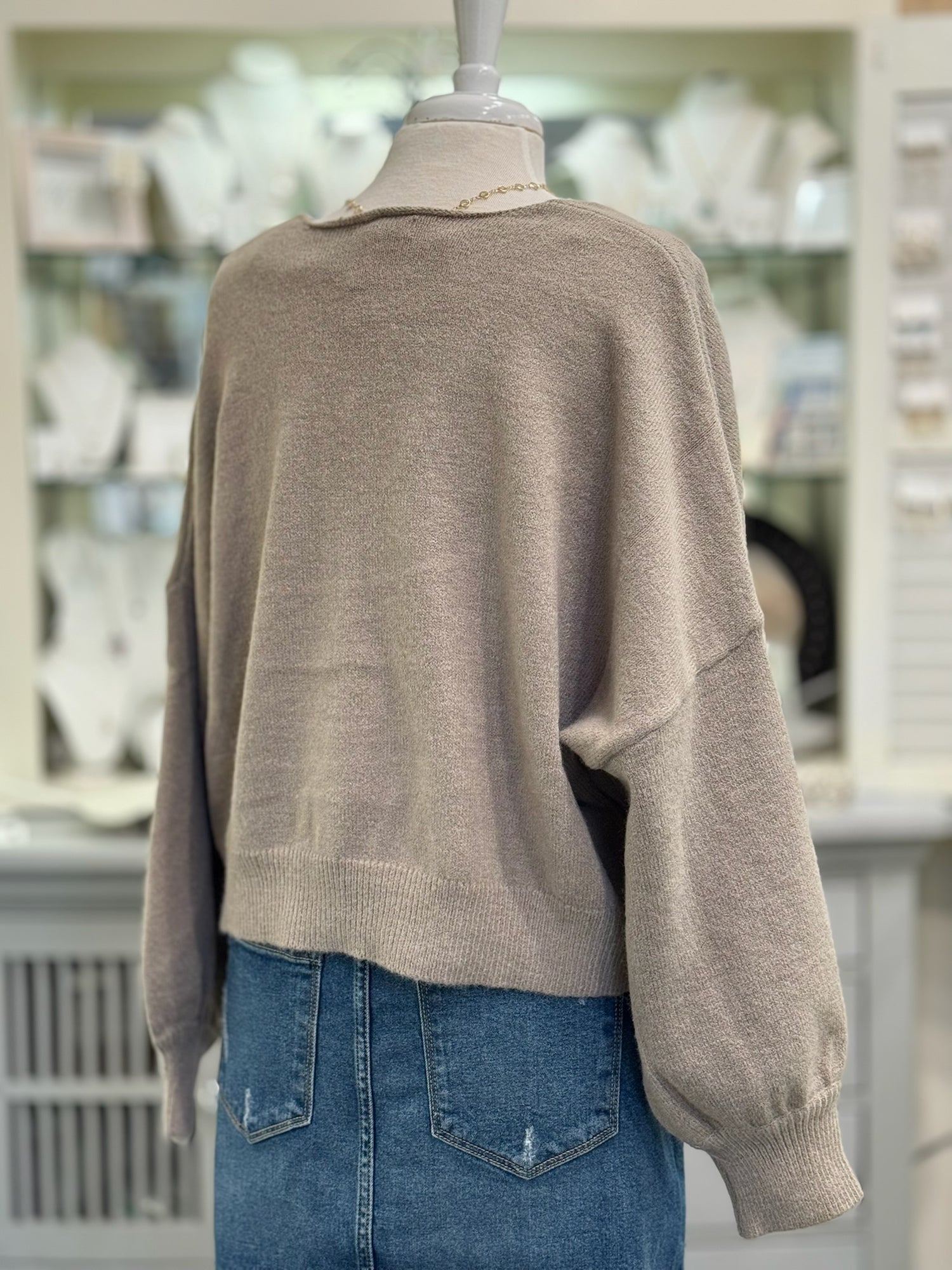 Back view of mocha reversible cropped sweater 
