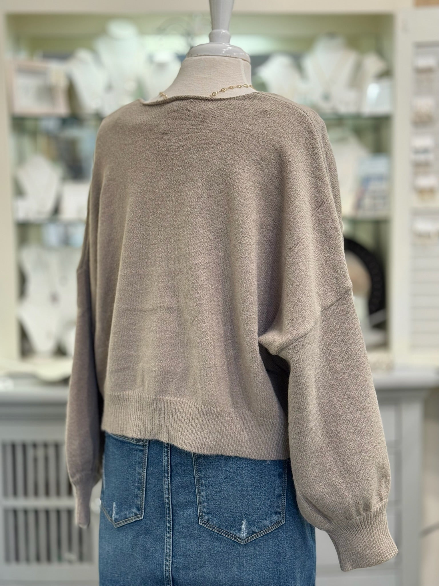 Back view of mocha reversible cropped sweater 