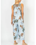 Back view of the Sienna Leaf Print Linen Romper with tie-back detail