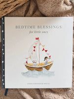 Children's book titled 'Bedtime Blessings for little ones' with a sailboat illustration on a soft fabric background.