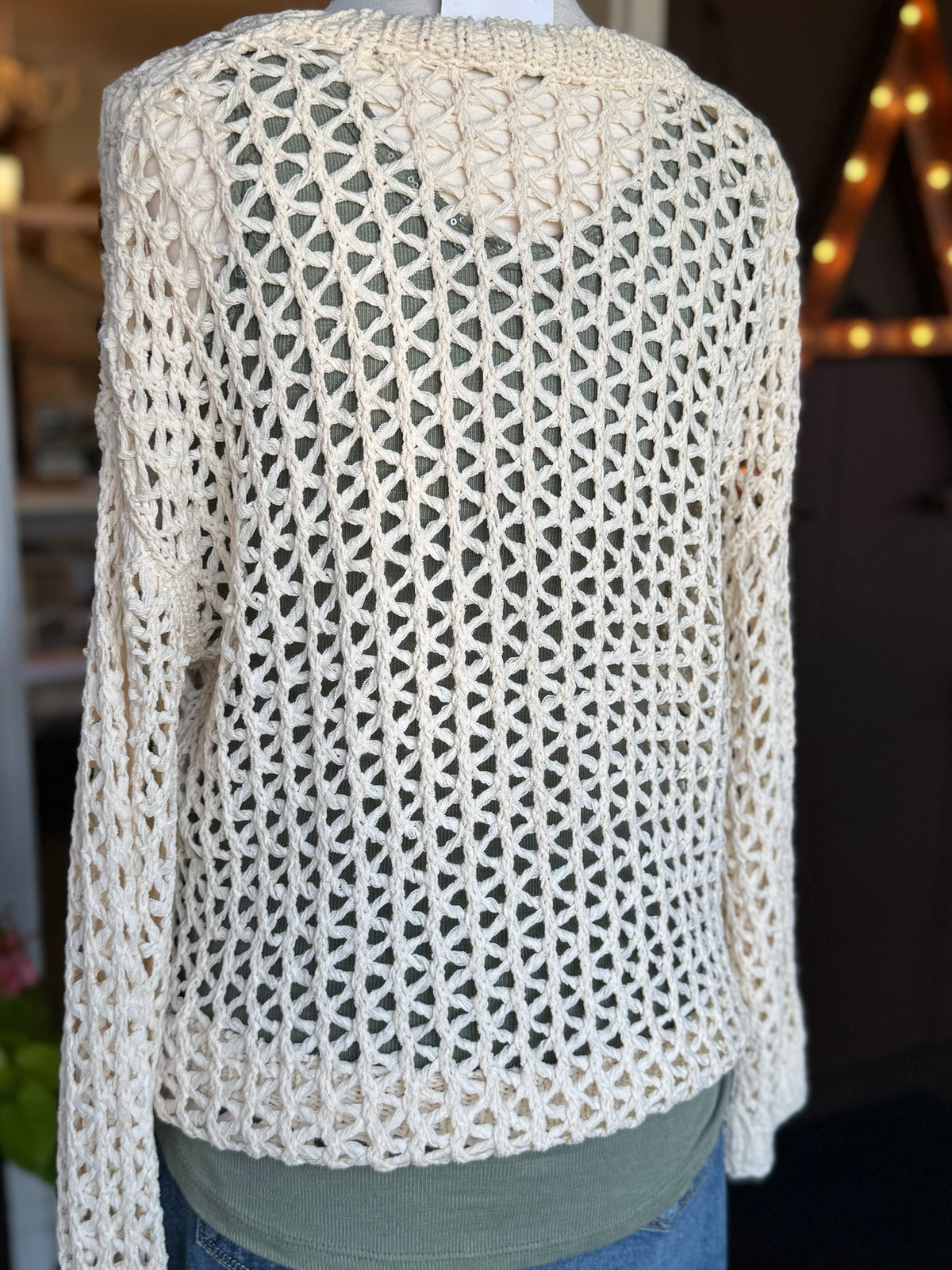 Back view of the Bree Open Knit Sweater in beige showing the open-knit pattern, long sleeves and relaxed silhouette at Ardor Boutique.