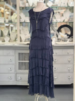 Front view of the Briella Layered Silk Dress in navy, Italian-made. Styled with grey pearl necklace