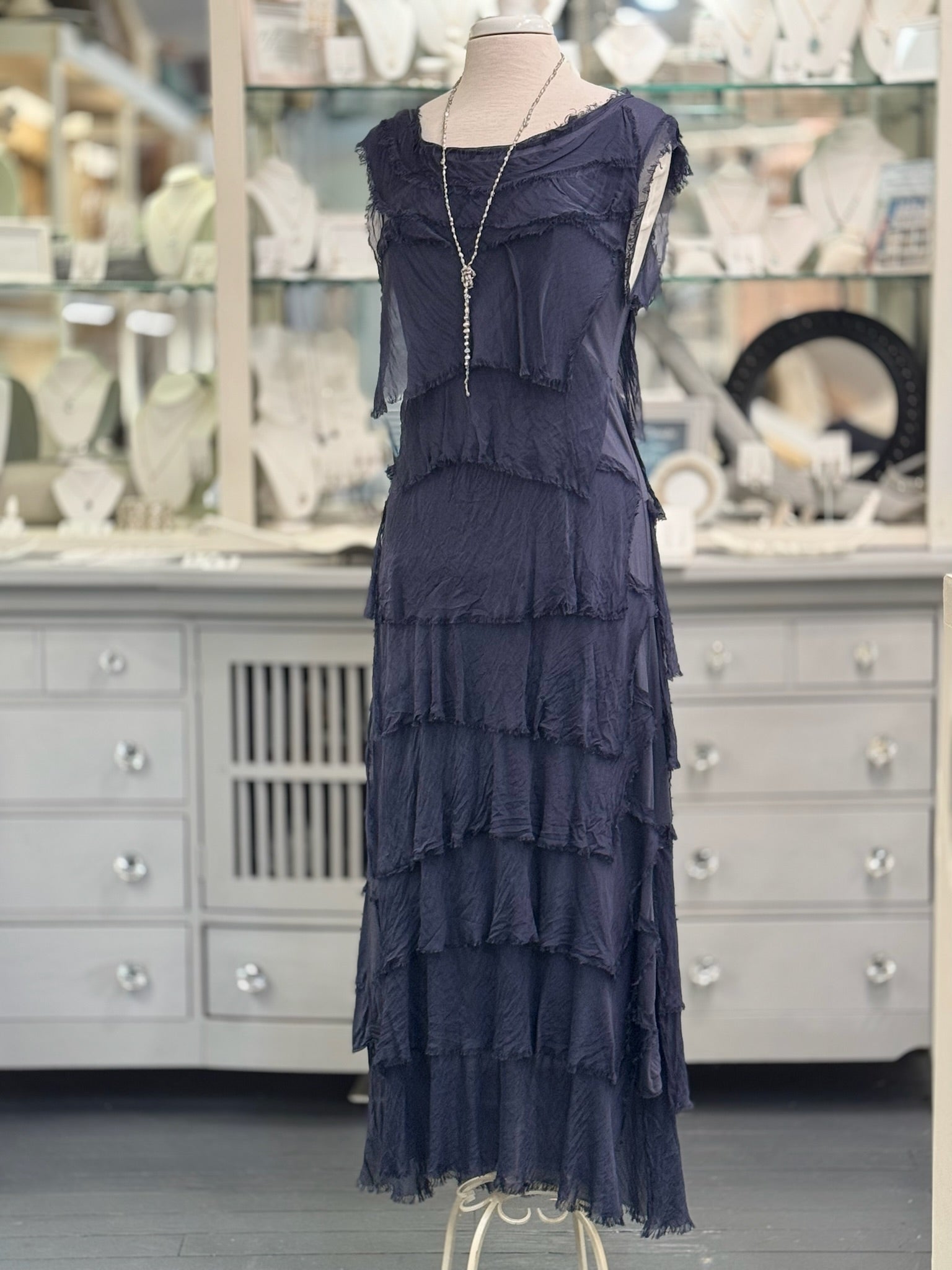 Front view of the Briella Layered Silk Dress in navy, Italian-made. Styled with grey pearl necklace