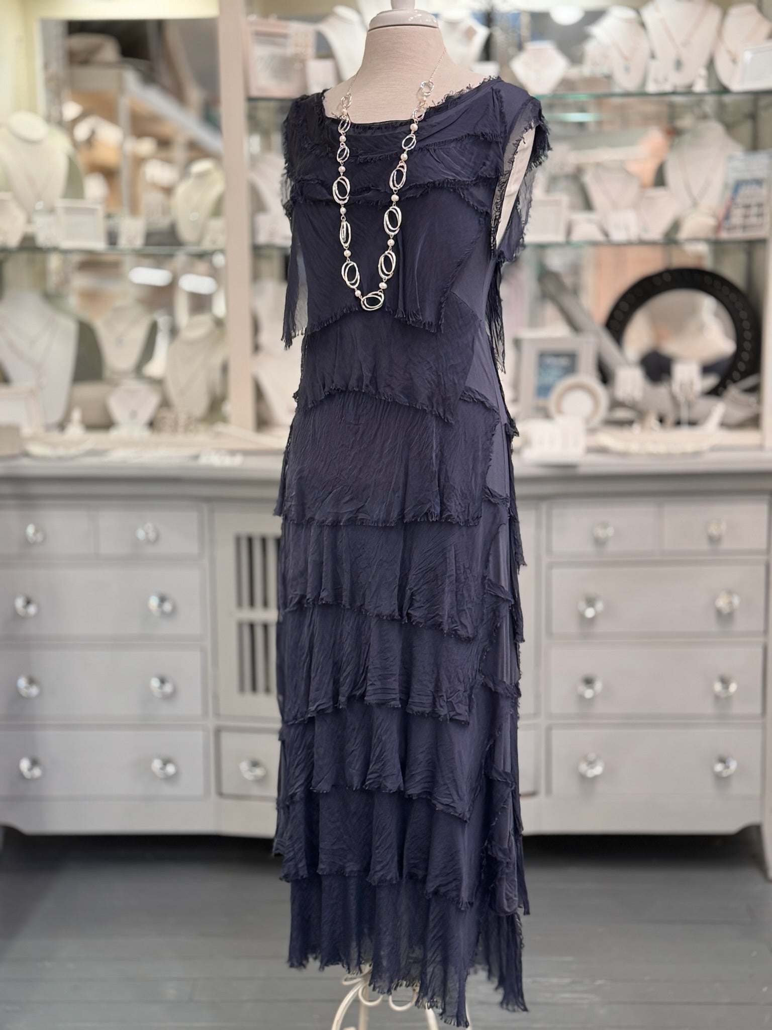 Briella Layered Silk Dress in navy, made in Italy with flowing washable silk tiers. Styled with long pearl and silver necklace